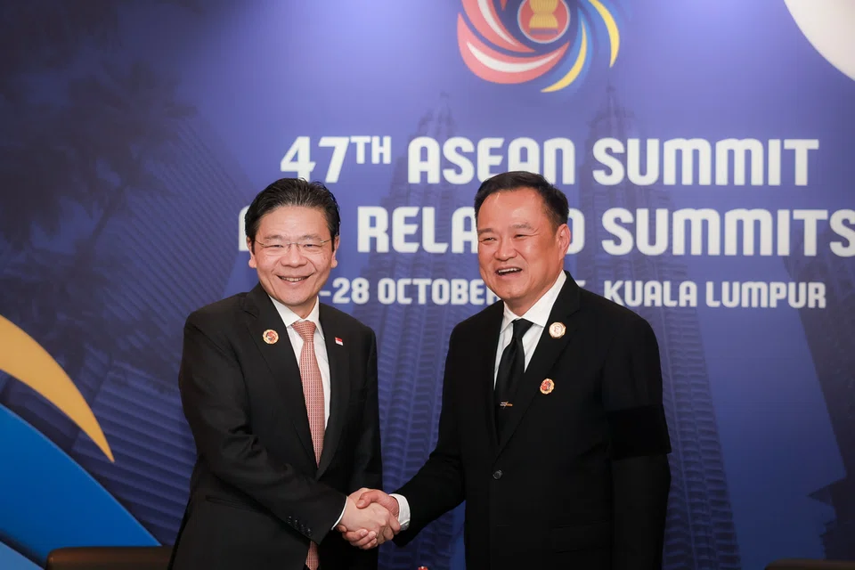 PM Lawrence Wong (left) meeting his Thai counterpart, Mr Anutin Charnvirakul, on the sidelines of the Asean Summit in Kuala Lumpur on Oct 27. ST PHOTO: GAVIN FOO