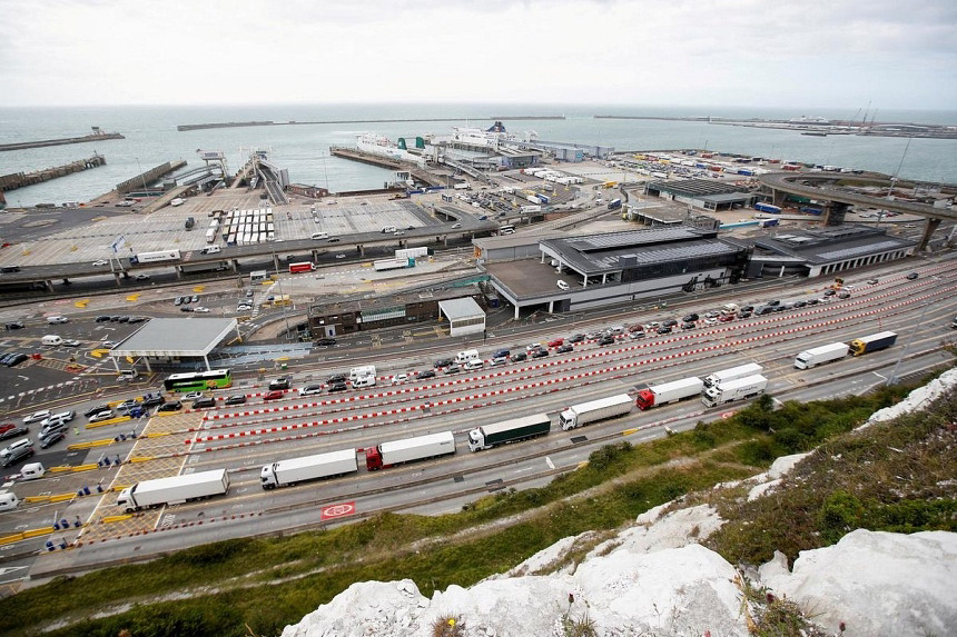 Vehicles queue at the border control booths at the Port of Dover, in Dover, Britain