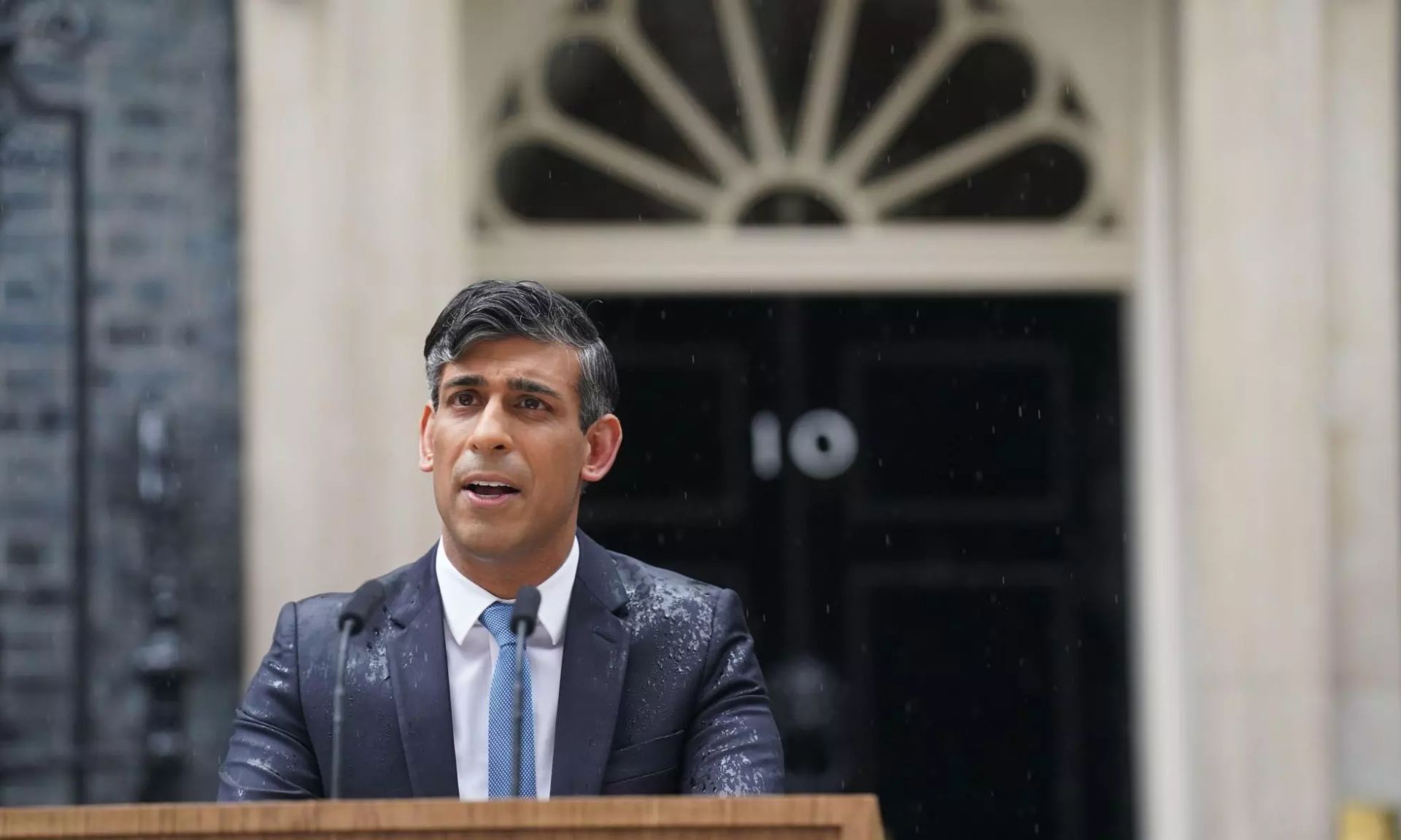 Rishi Sunak braves the Downing Street rain to announce the date of the next general election to the public.
