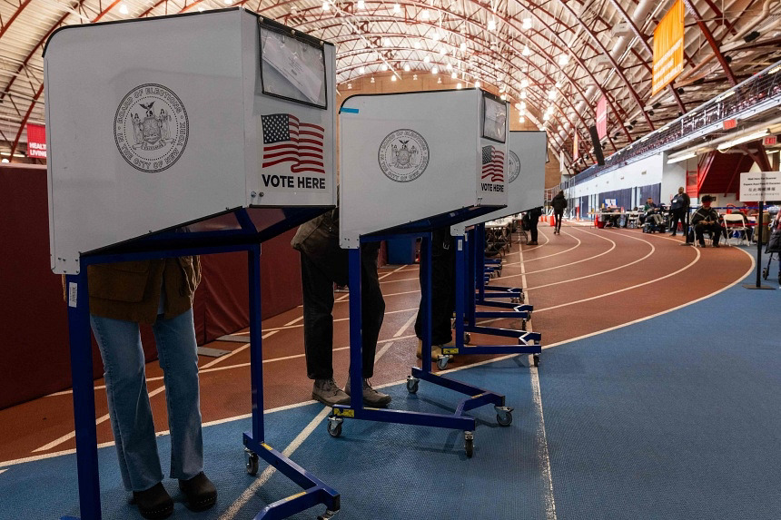 New Yorkers participate in early voting at a polling site in Brooklyn on Oct 29. US voters do not directly elect the president and vice-president. 