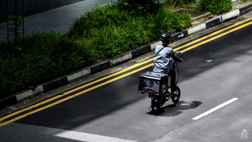 A food delivery rider seen in Singapore's central business district on Jan 14, 2022.