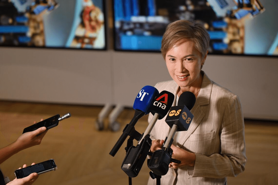 Minister for Digital Development and Information Josephine Teo speaking to the media after a tour of the UBS AI and transformation factory on Oct 6.  ST PHOTO: AZMI ATHNI