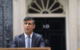Rishi Sunak braves the Downing Street rain to announce the date of the next general election to the public.